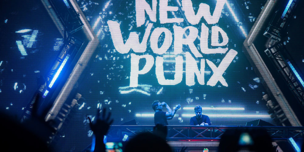 New World Punx logo on screen during concert
